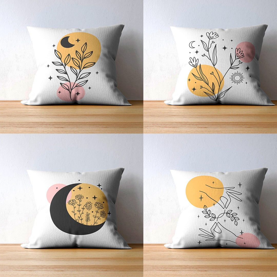 Four white cushion covers with delicate botanical outlines and yellow and pink circles.