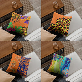 Four cushion covers with vivid abstract foliage and animal-print designs.
