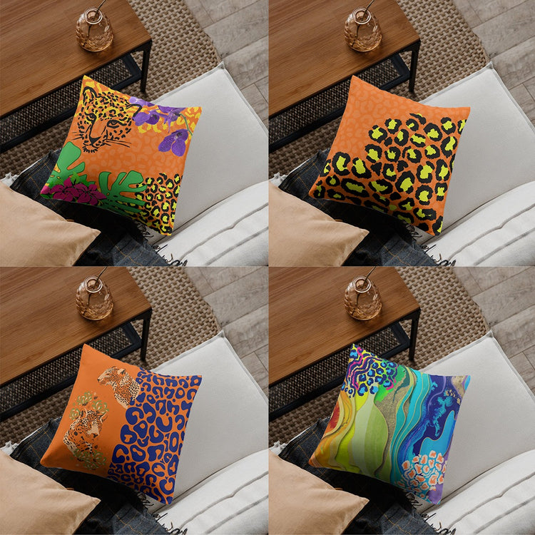 Four cushion covers with vivid abstract foliage and animal-print designs.