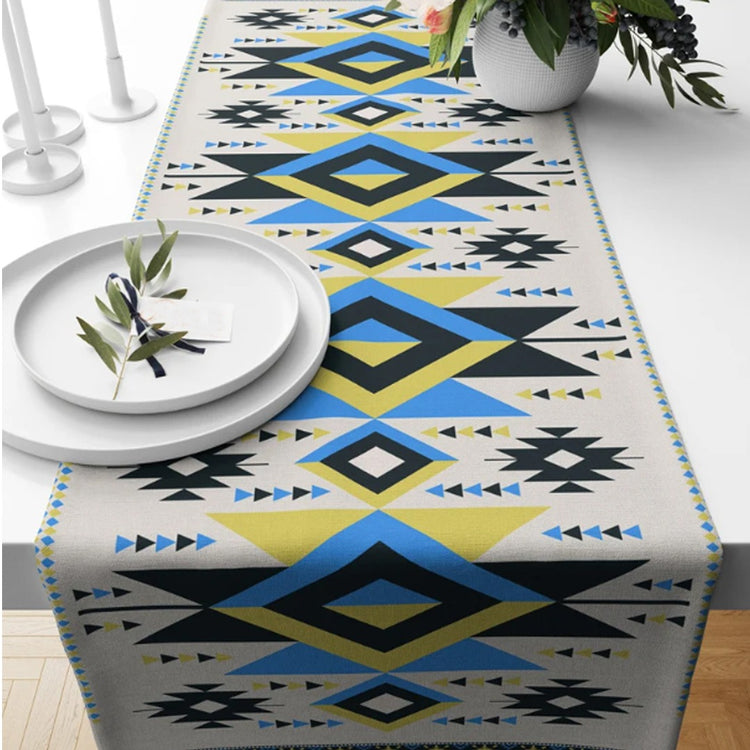 Cream table runner with blue, green and yellow geometric diamonds.