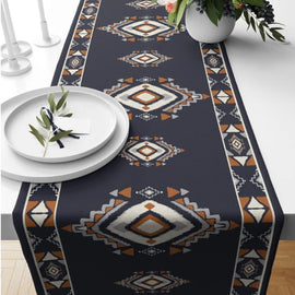 Navy table runner with cream and rust geometric diamond motifs.