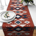 Rust table runner with cream, navy and blue geometric diamonds.