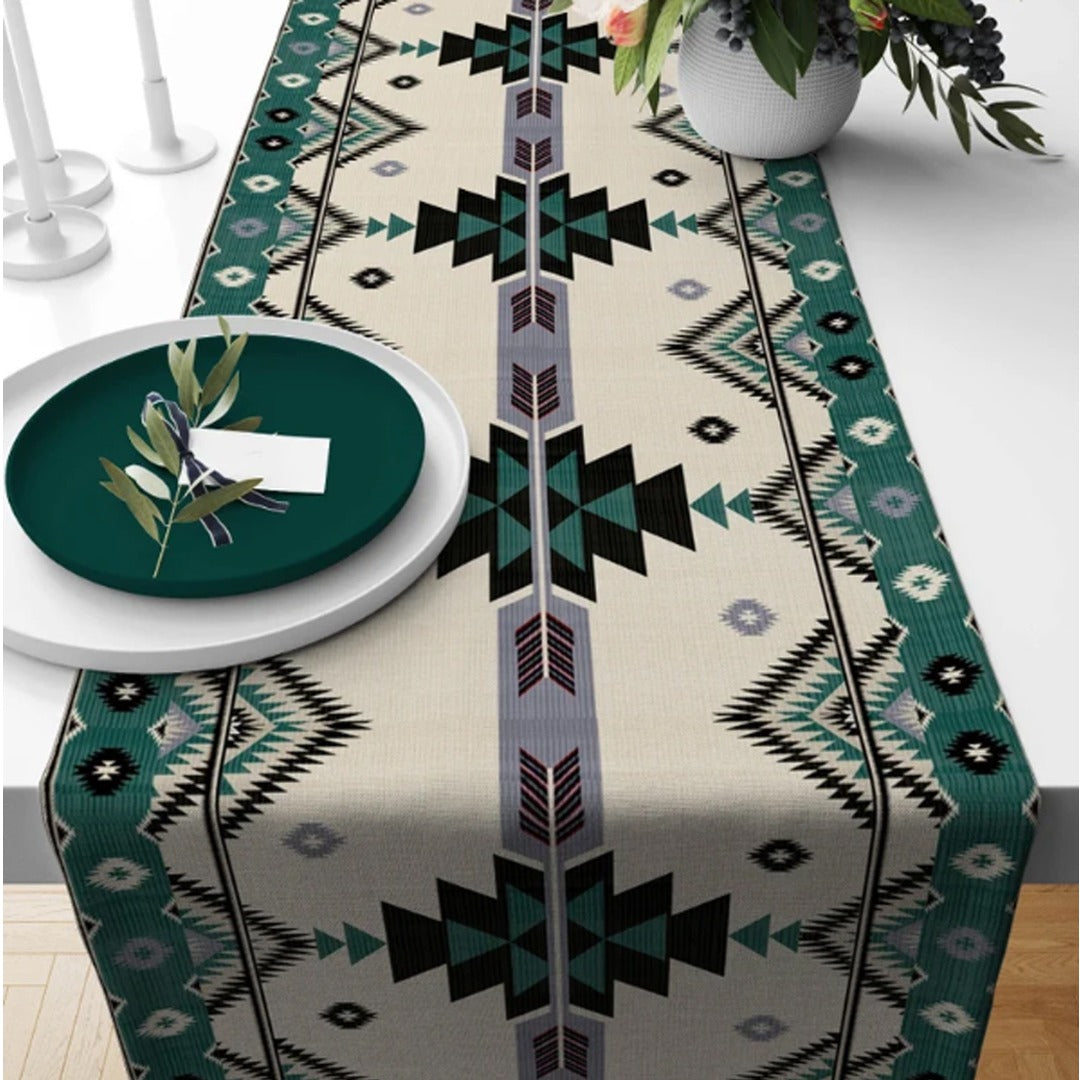 Cream table runner with black geometric motifs and teal borders.