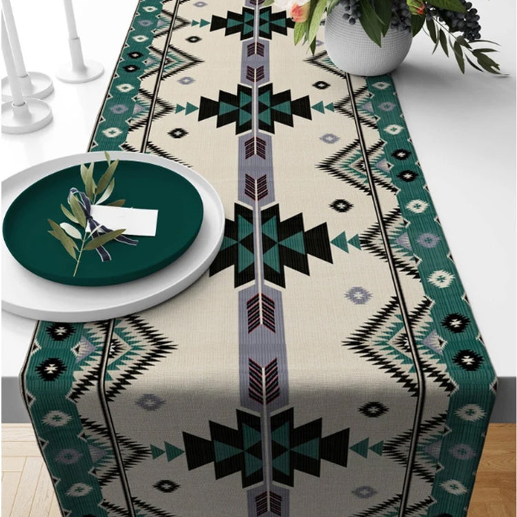 Cream table runner with black geometric motifs and teal borders.