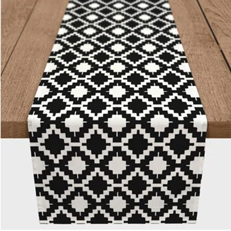 Close-up of the black and white diamond pattern on a table runner.