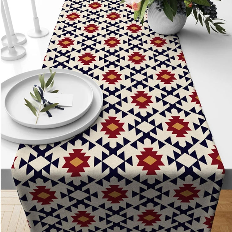 Cream table runner with small red, navy and yellow geometric star motifs.