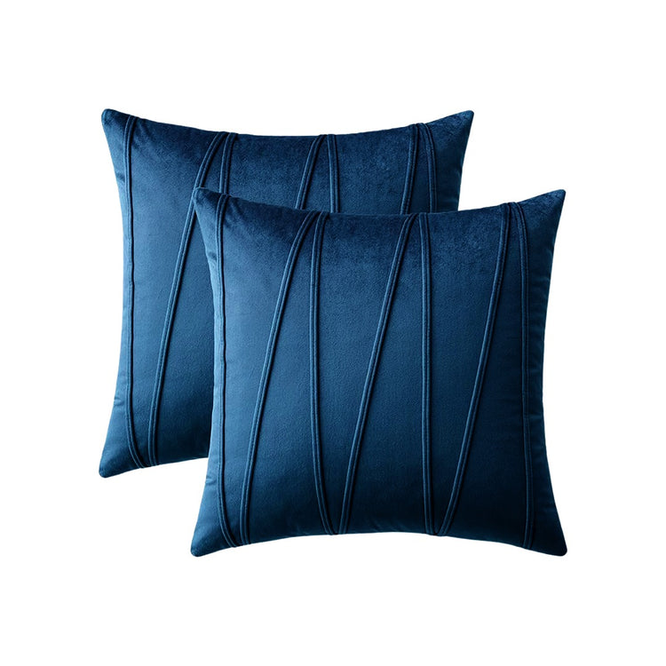 Two navy cushion covers with long angular stitched lines.