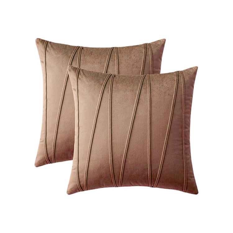 Two taupe cushion covers with long angular stitched lines.