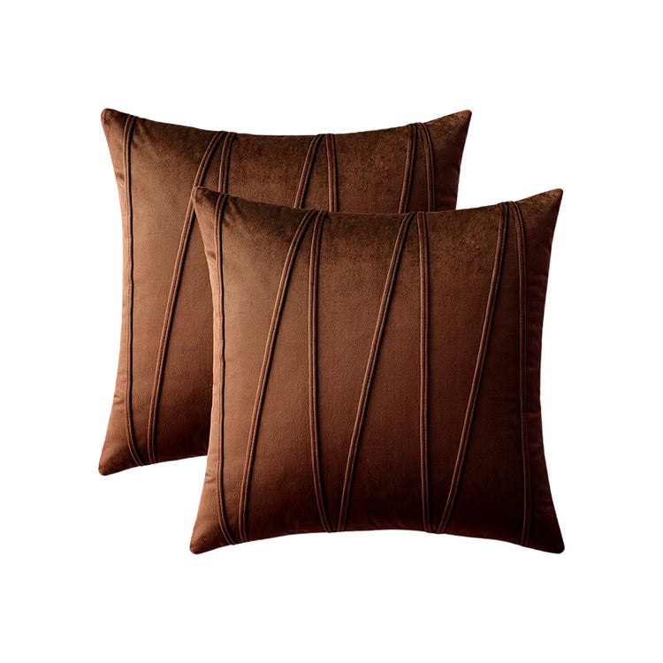 Two brown cushion covers with long angular stitched lines.