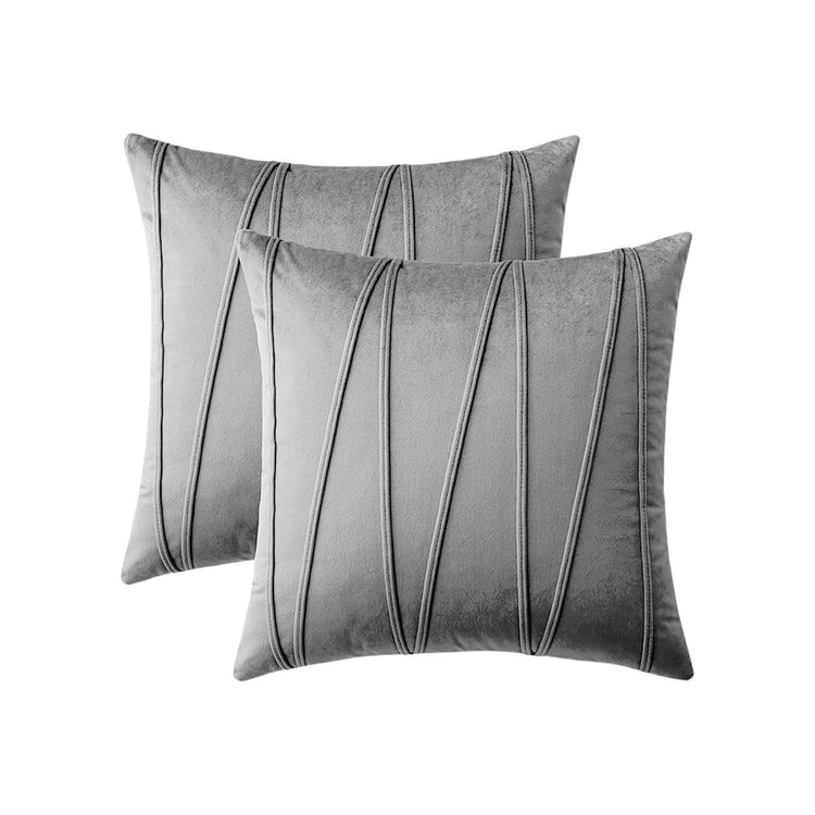 Two grey cushion covers with long angular stitched lines.
