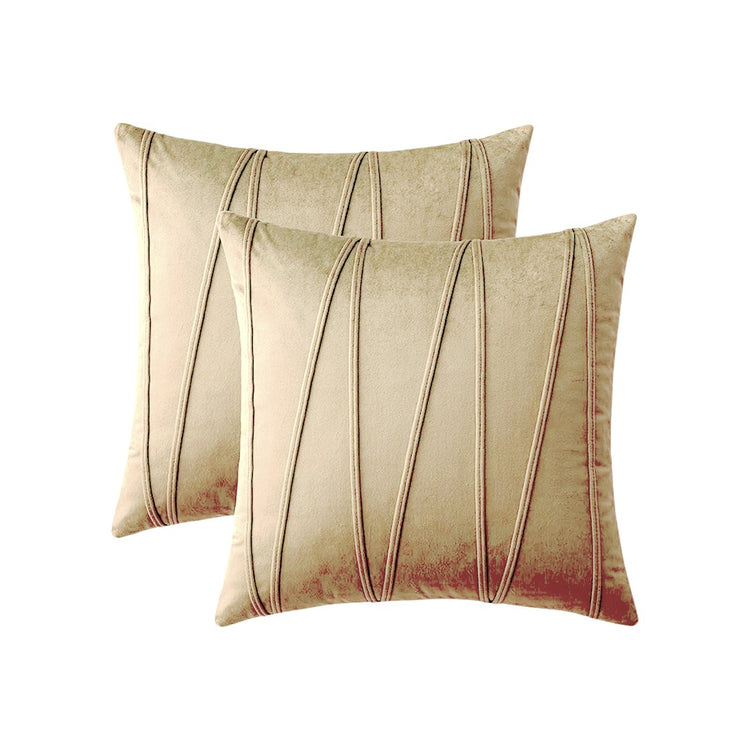 Two cream cushion covers with long angular stitched lines.