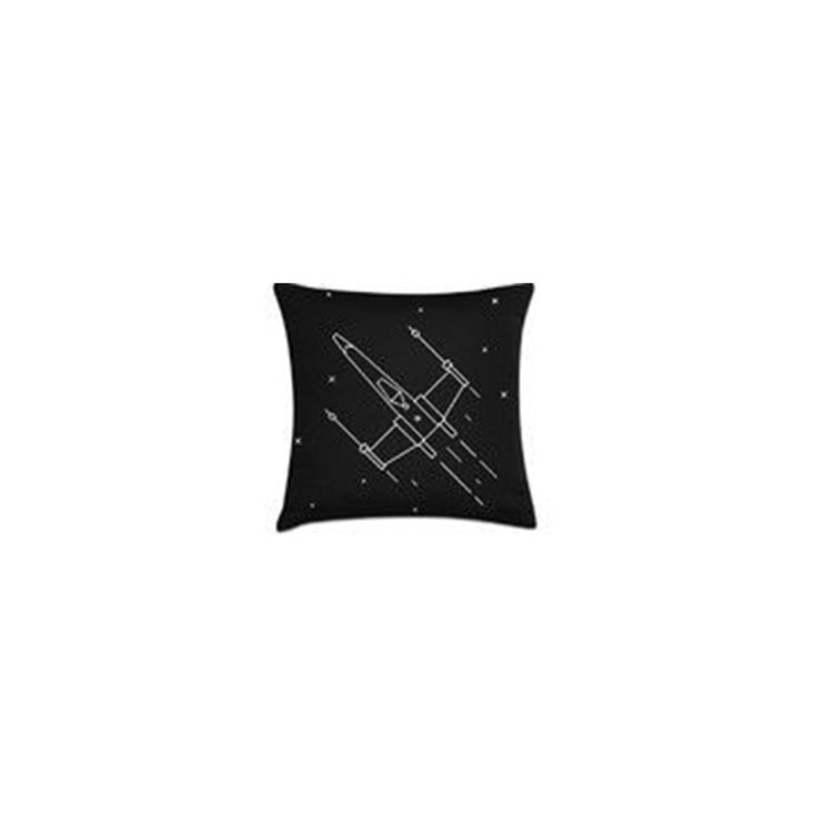 Black cushion cover with a white spacecraft line drawing.