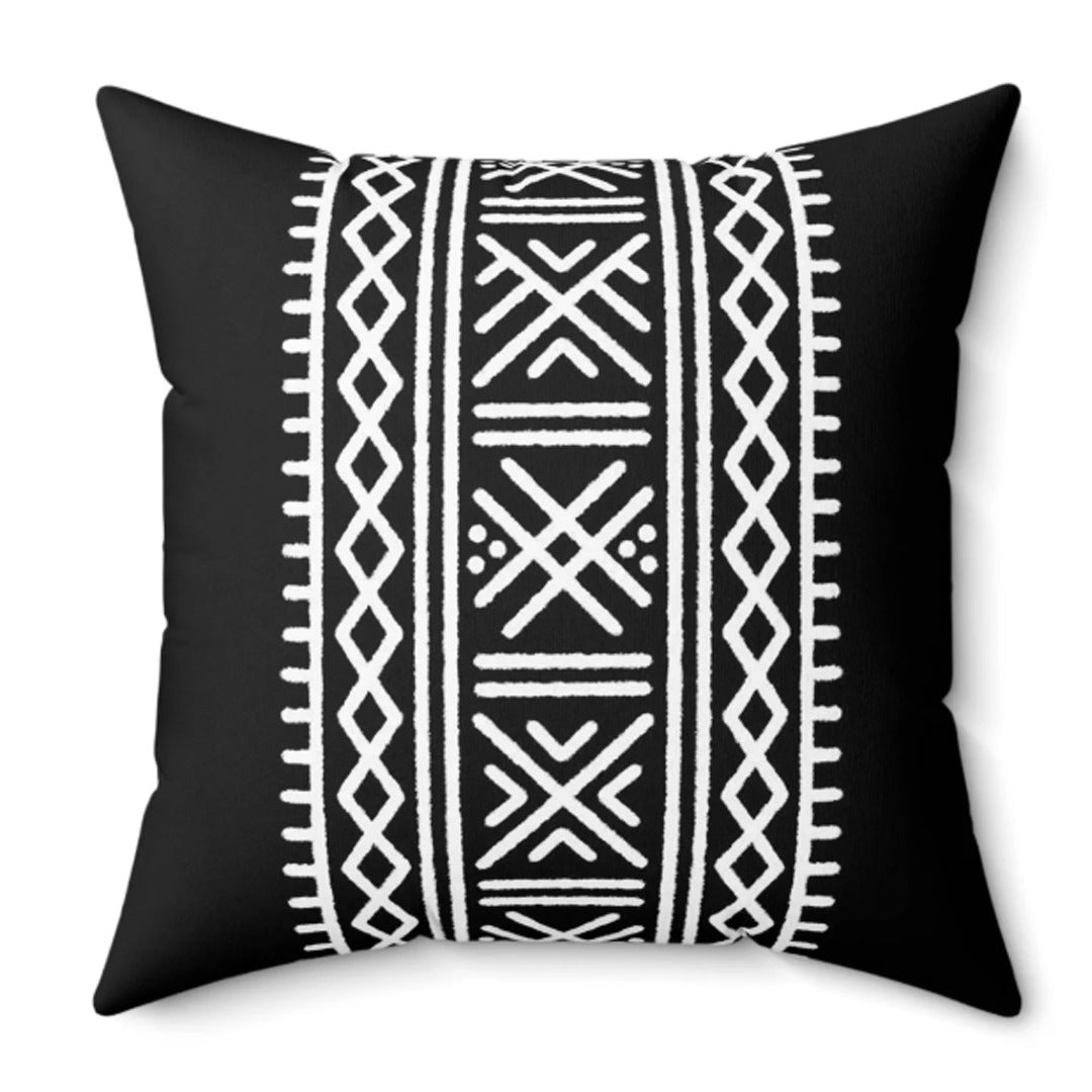 Black cushion cover with a wide vertical band of white geometric motifs.