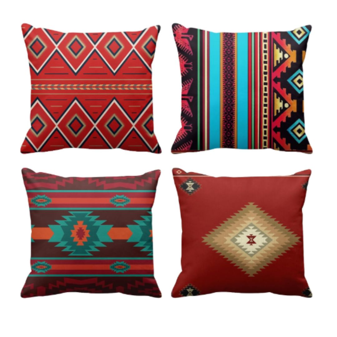 Four cushion covers with red, teal and multicoloured stripes and diamond motifs.