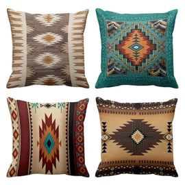 Four cushion covers with earthy brown, cream, rust and teal geometric diamond patterns.