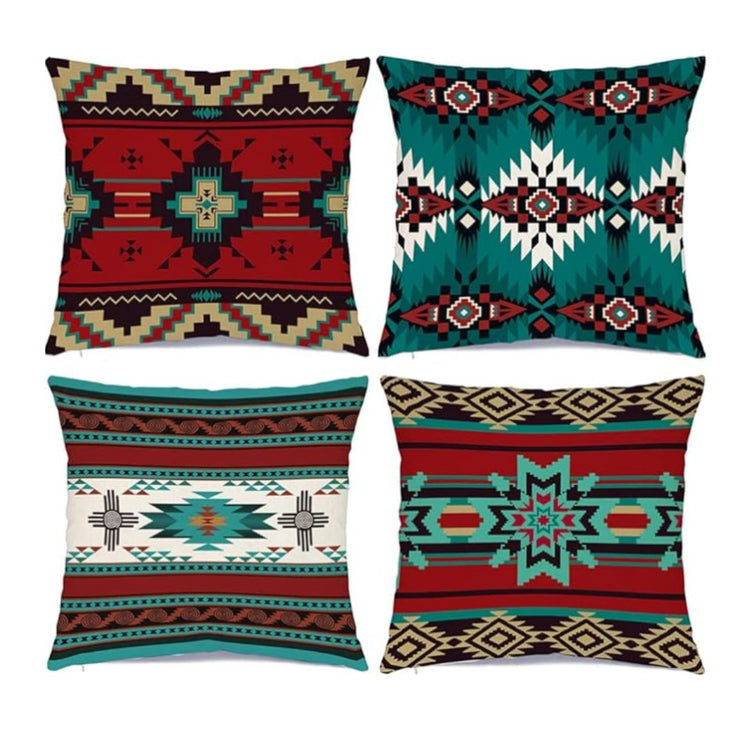 Four cushion covers with teal, red, black and cream geometric motifs.
