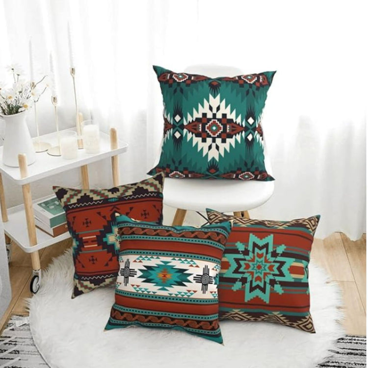 Teal, rust and cream geometric cushion covers displayed in a bright room.