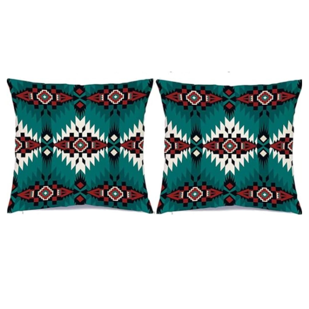 Two turquoise cushion covers with black, red and white stepped diamond patterns.