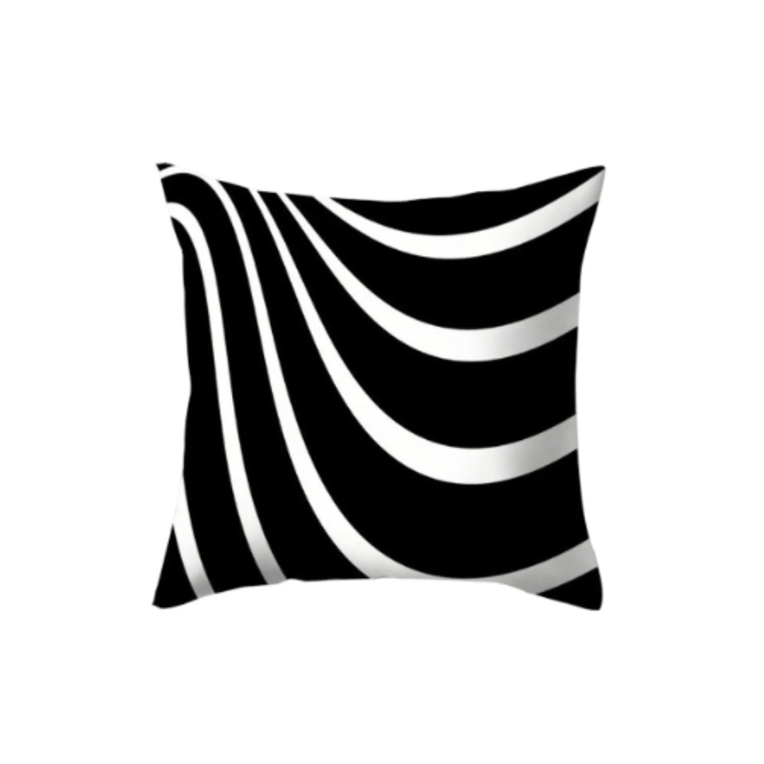 Black cushion cover with white curves sweeping from one corner.