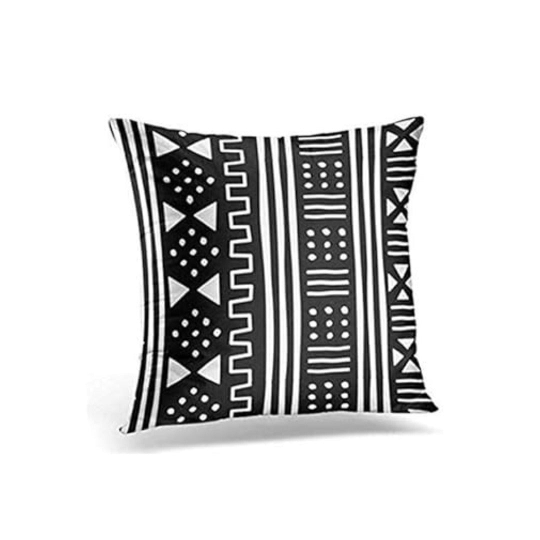 Black cushion cover with narrow vertical bands of white geometric lines and dots.