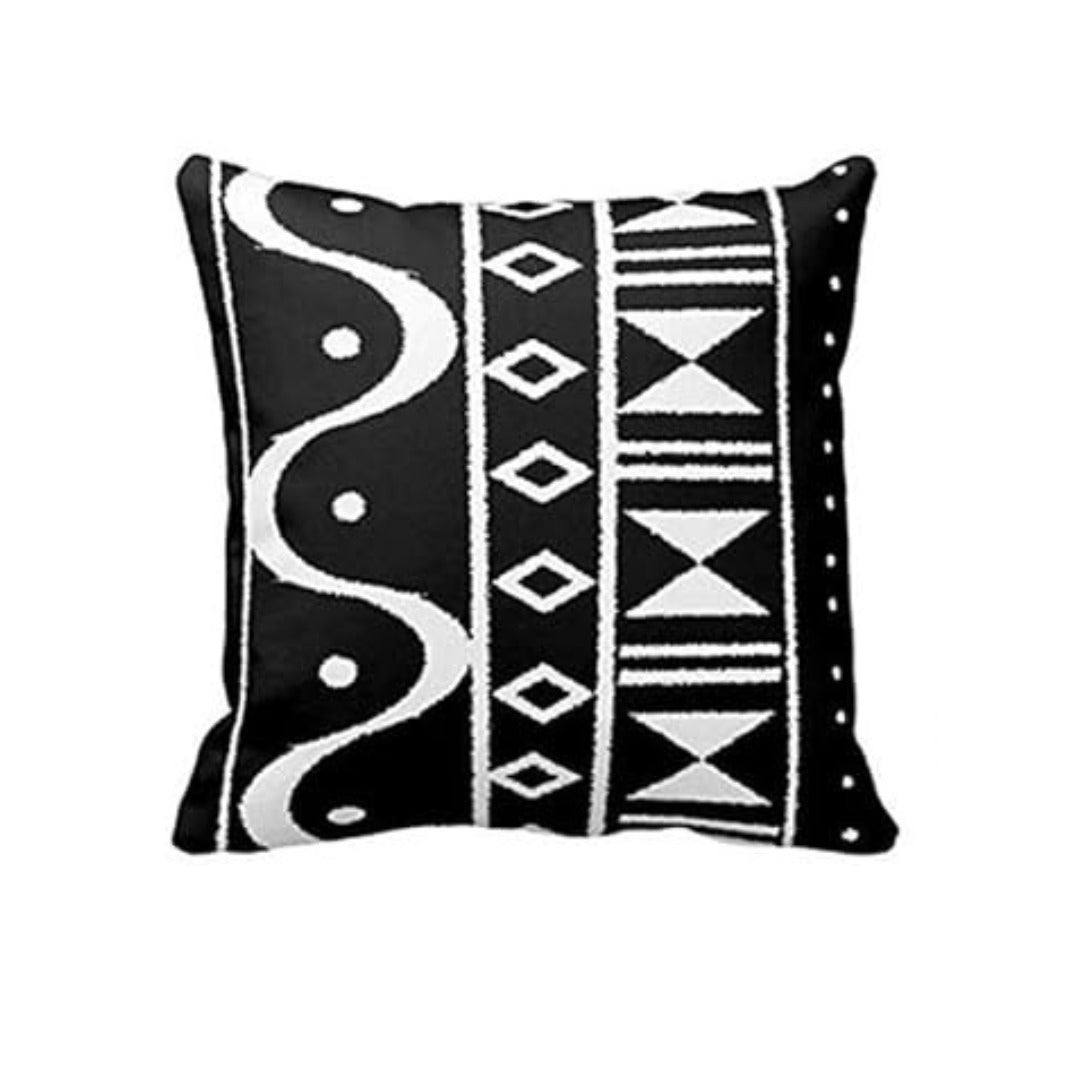Black cushion cover with white wavy lines and vertical bands of diamonds and triangles.