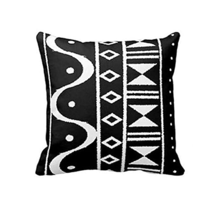 Black cushion cover with white wavy lines and vertical bands of diamonds and triangles.