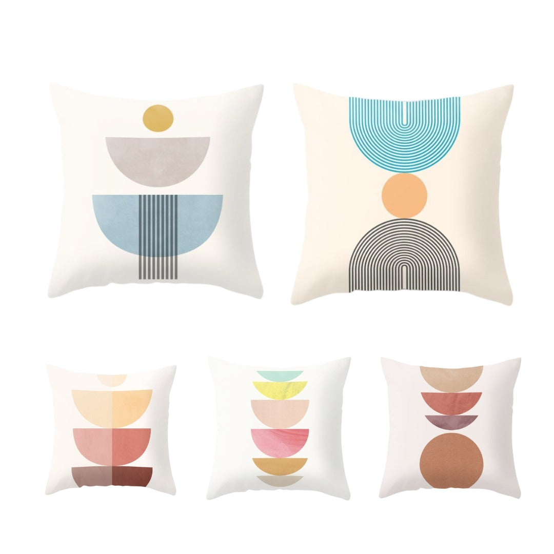 Five cream cushion covers with stacked pastel semicircle and circle designs.