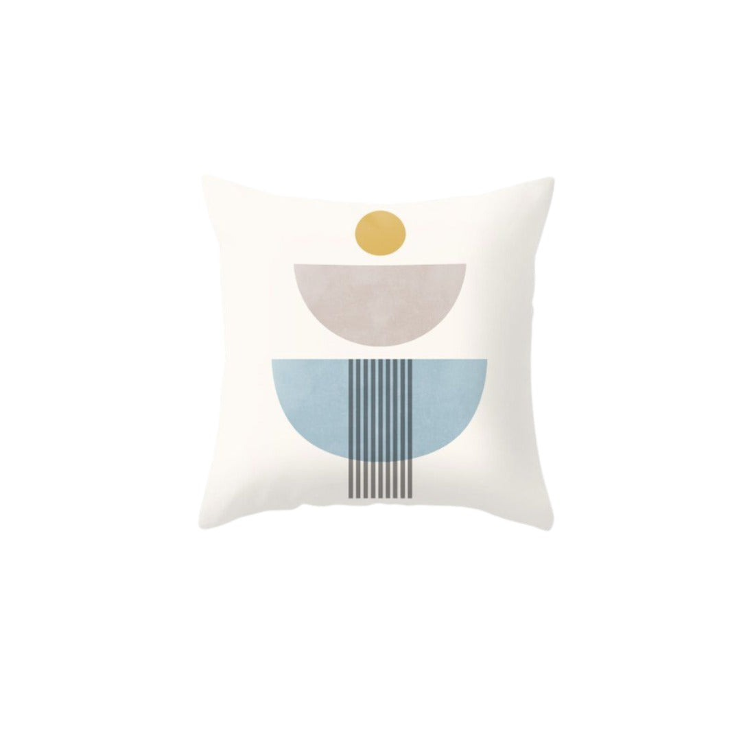 Cream cushion cover with grey and blue lined semicircles beneath a small mustard circle.