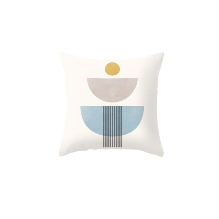 Cream cushion cover with grey and blue lined semicircles beneath a small mustard circle.
