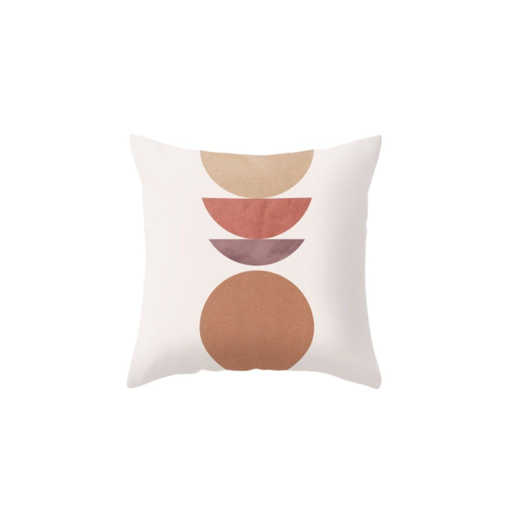 Pale pink cushion cover with stacked rust semicircles above a large brown circle.