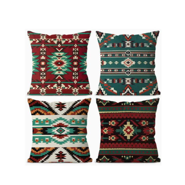 Four cushion covers with red, teal, black and cream geometric bands and diamond motifs.