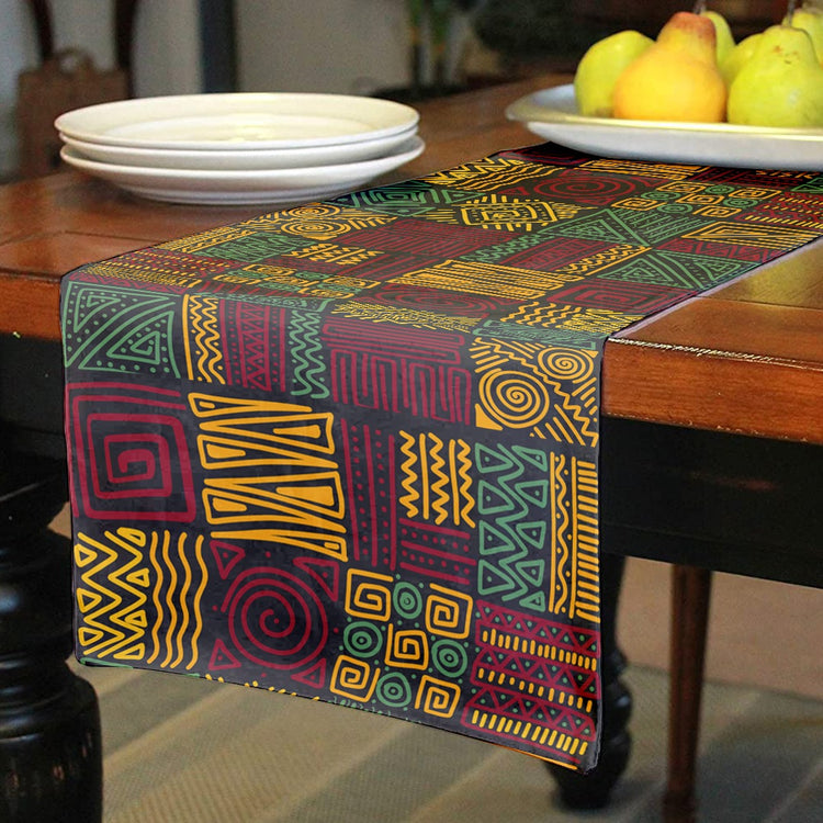 Close view of a multicoloured geometric patchwork-pattern table runner.