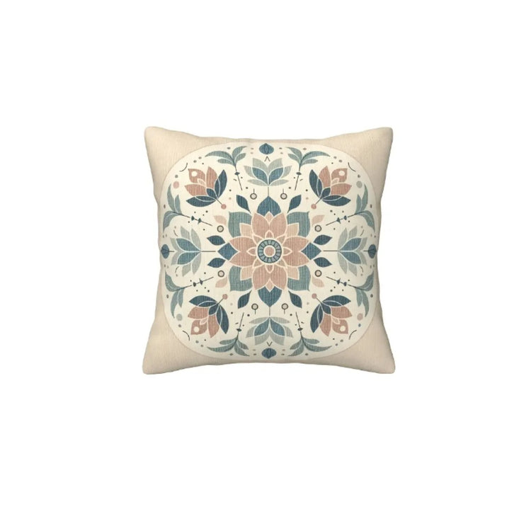 Cream cushion cover with a small peach medallion surrounded by muted blue floral motifs.