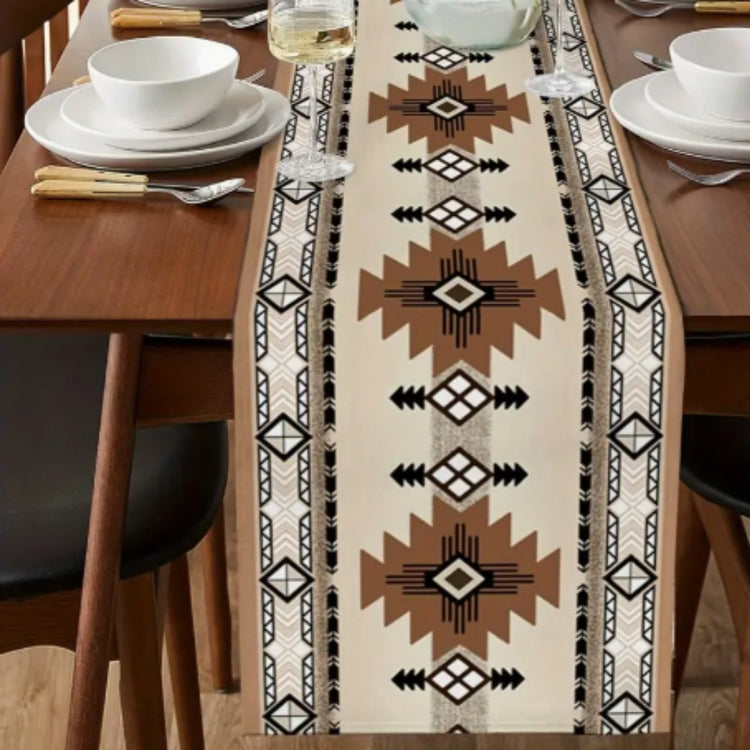 Cream table runner with brown geometric stars and black diamond motifs.