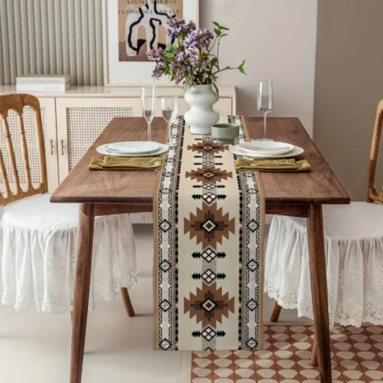 Cream and brown geometric table runner in a dining-room setting.