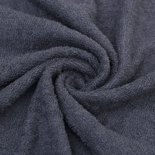 Close-up of charcoal grey towel fabric twisted to show its texture.