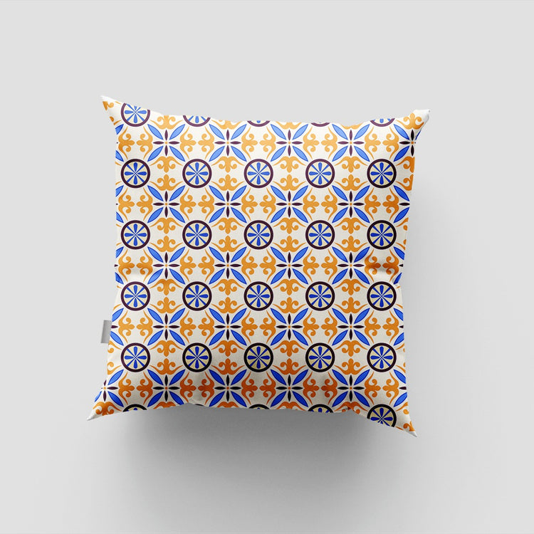 Cushion cover with a repeating blue, orange and yellow circular geometric pattern.
