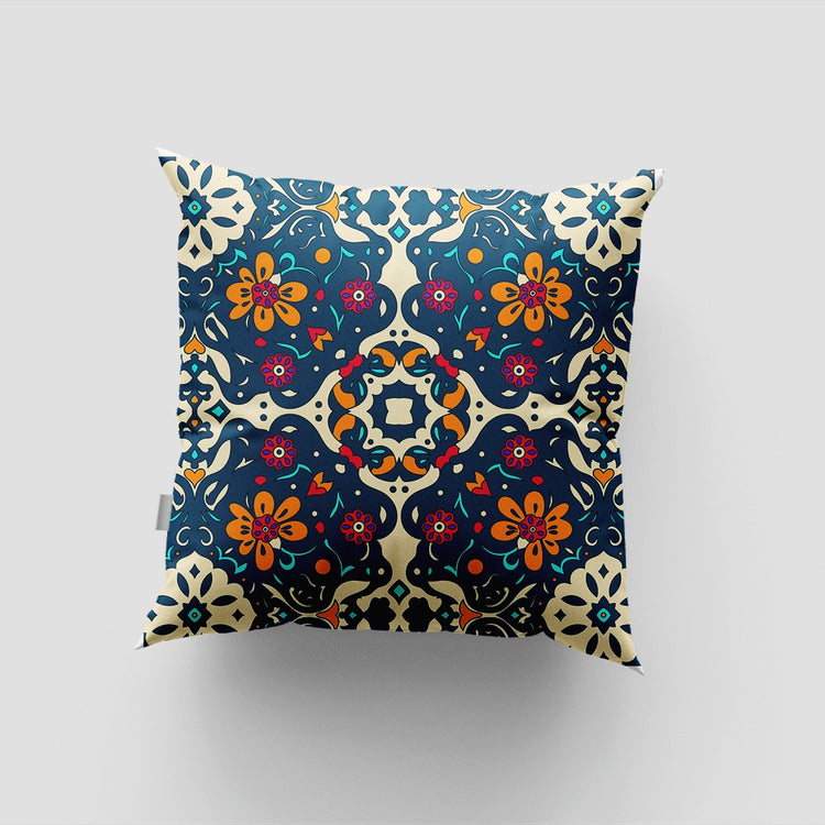 Navy cushion cover with small red, yellow, blue and cream floral motifs.