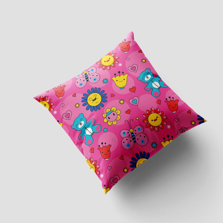 Pink cushion cover with small colourful flowers and circular motifs.