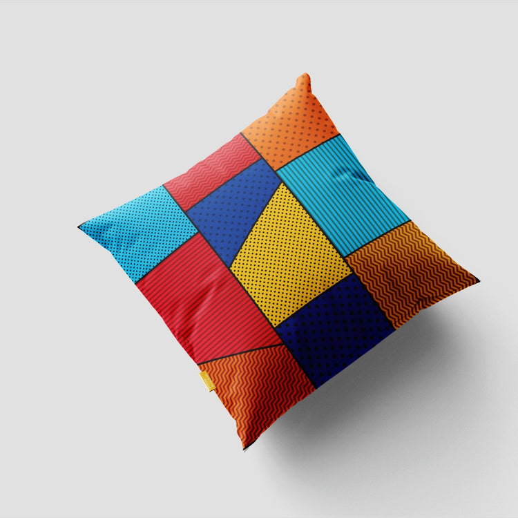 Cushion cover with bright blue, yellow, orange and red patchwork squares.