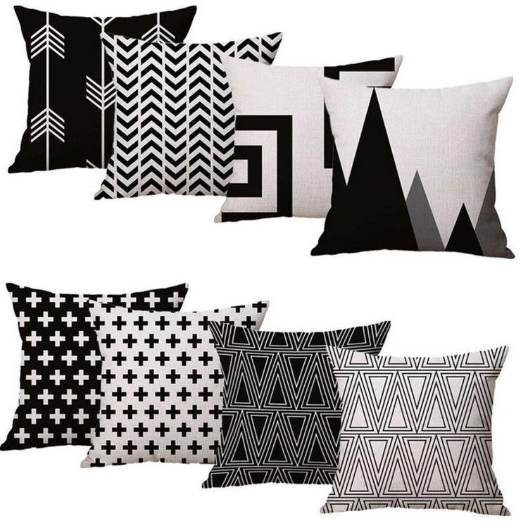Eight black, white and grey cushion covers with assorted bold geometric prints.