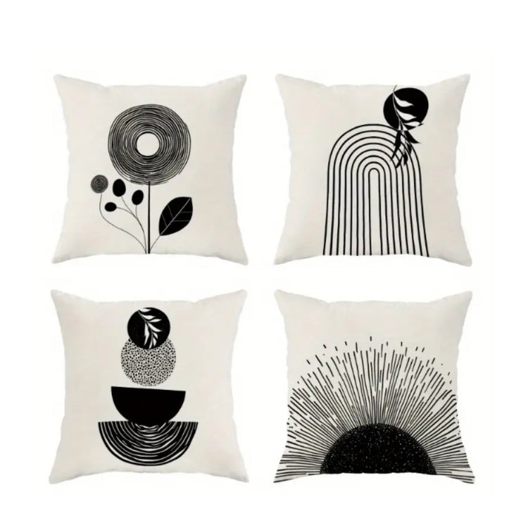 Four cream cushion covers with black floral, arch and semicircle line designs.
