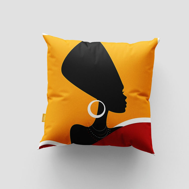 Yellow cushion cover with a black profile silhouette, large earring and red shoulder detail.