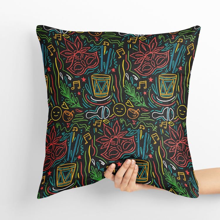Dark green cushion cover with intricate multicoloured festival-themed line drawings.
