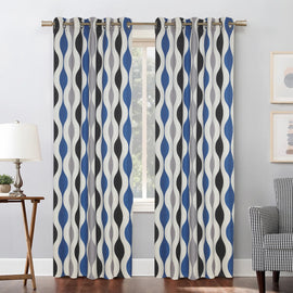 Blue, black and cream wavy-pattern curtains hanging at a window.