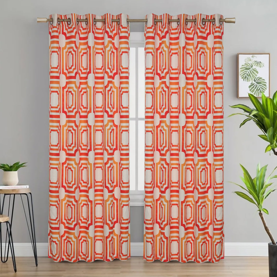 Orange and cream geometric eyelet curtains hanging at a window.