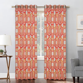 Orange and cream geometric eyelet curtains hanging at a window.