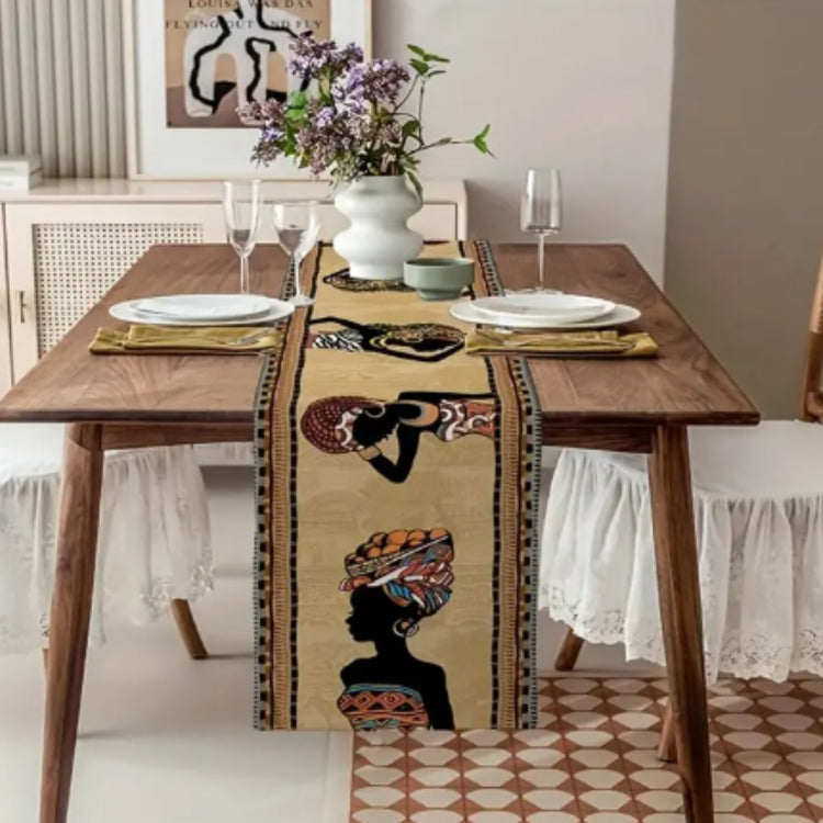 Beige table runner with illustrated women in colourful headwraps.
