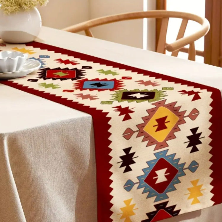 Red-bordered geometric diamond table runner draped over a dining table.