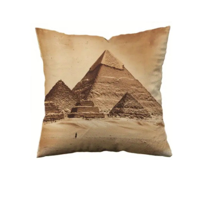 Beige cushion cover with a sepia illustration of pyramids in a desert landscape.